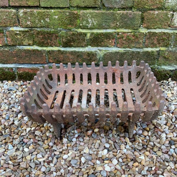 Antique cast iron fireplace grate for hearth and home.