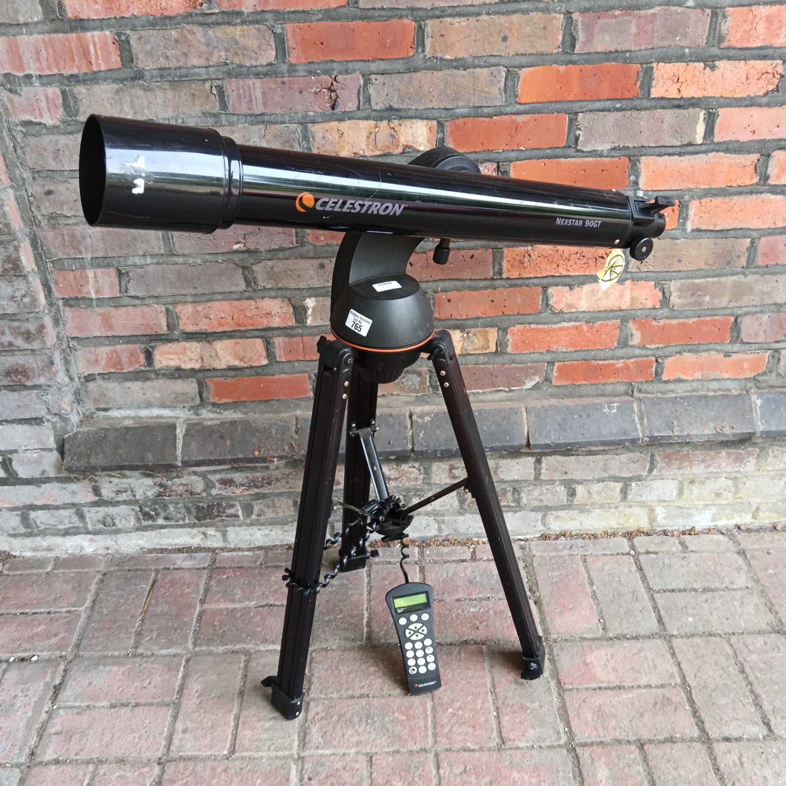Celestron Nexstar 90GT telescope with tripod and hand control.