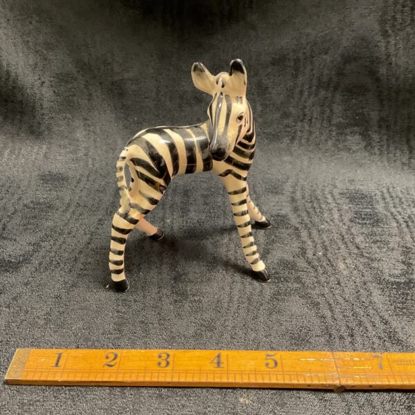 Vintage ceramic zebra foal figurine, a charming collectible.