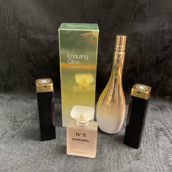 Perfume gift set featuring Chanel No 5 and Jennifer Lopez Enduring Glow bottles.