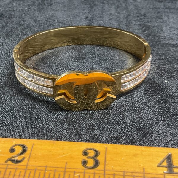 Gold Chanel style bracelet with clear crystals.