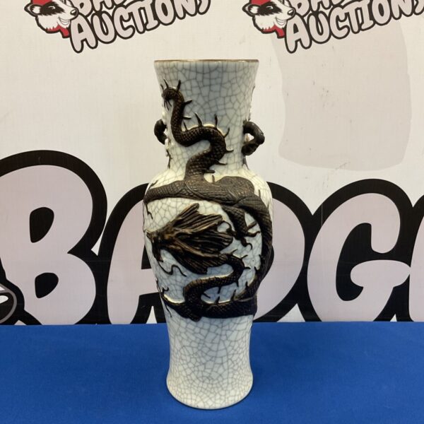 Detailed Chinese crackle glaze dragon vase with black dragon design.