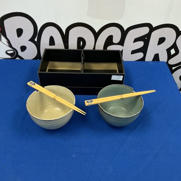 Two Chinese rice bowls in a presentation box, traditional Asian dinnerware.