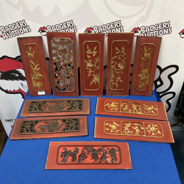 Vintage Chinese wooden panels with detailed faunal and performer carvings.