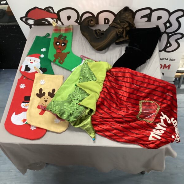 Mixed lot of colourful Christmas stockings for festive holiday decor.