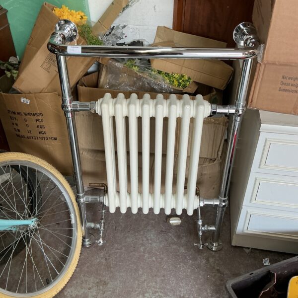 Polished chrome bathroom radiator with multiple horizontal bars.