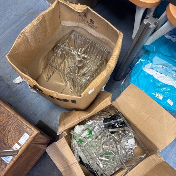 Chrome pendant lights in cardboard box, vintage lighting fixture.