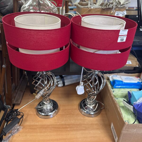 Pair of vintage chrome table lamps with red shades.