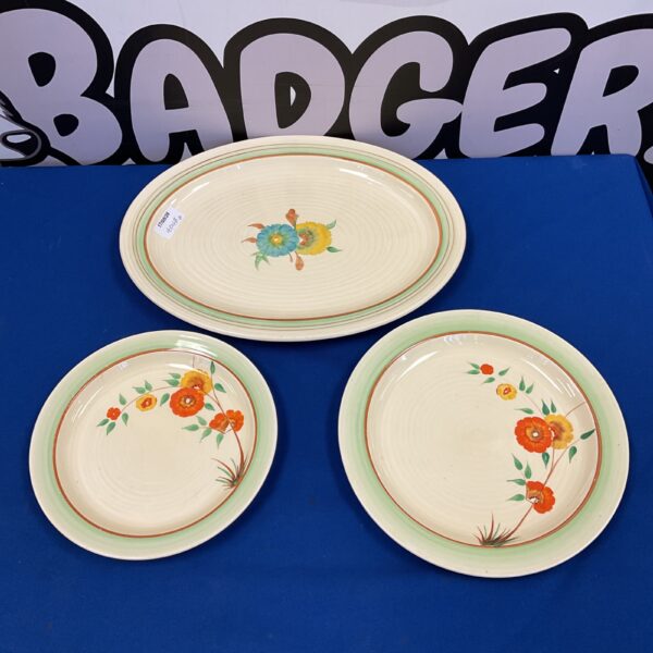 Vintage Clarice Cliff floral plates, colourful Art Deco pottery.
