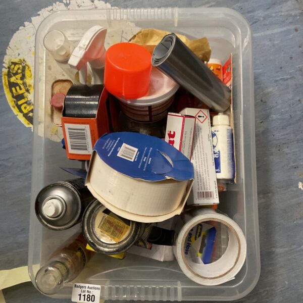 Mixed lot of cleaning supplies in a plastic container.