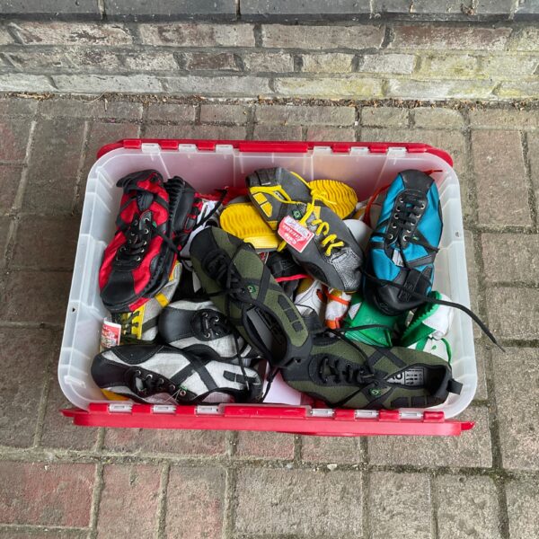 Overview of a large lot of used climbing shoes for rock climbing.