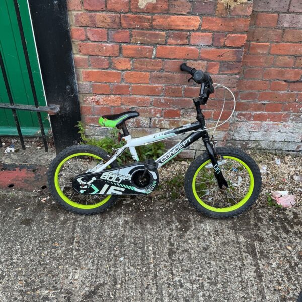 Used Concept Bolt kids bike with green accents.