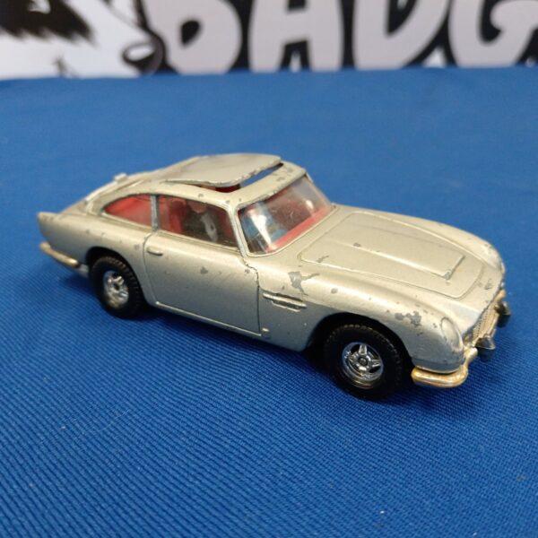 Vintage Corgi James Bond Aston Martin DB5 diecast car side view.