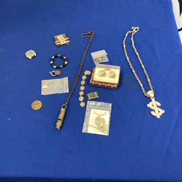 Mixed lot of vintage costume jewellery with antique whistle and necklace.