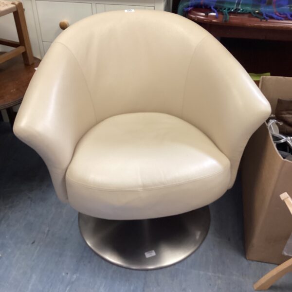 Cream leather swivel chair with chrome base.