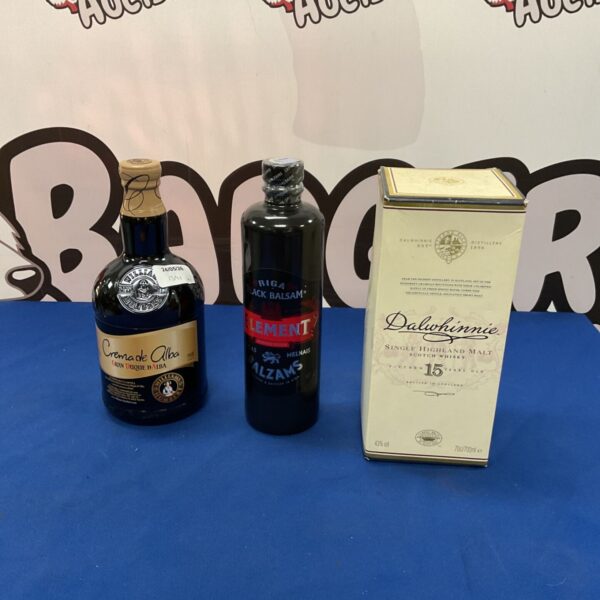 Vintage bottles of Crema de Alba, Black Balsam, and Dalwhinnie whiskey.