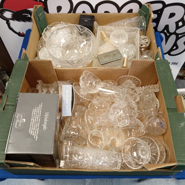Vintage crystal and cut glass collection displayed on a tray.