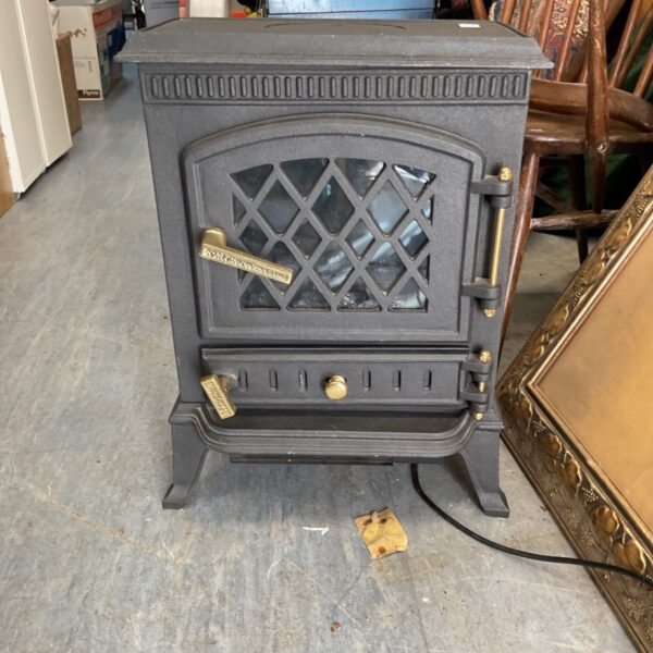 Black cast iron Crytec JA010 wood stove, vintage heating appliance.