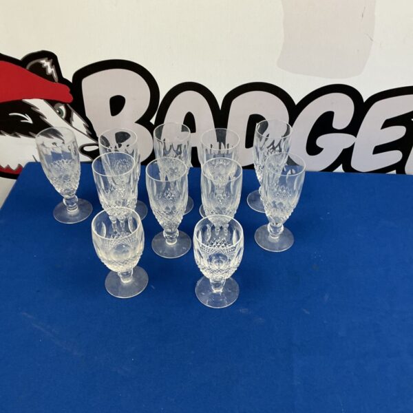 Set of vintage cut glass wine glasses for elegant dining.