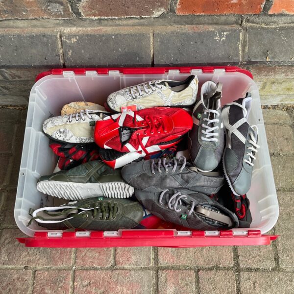 Overview of a large lot of used dancing trainers.
