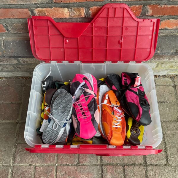 Overview of a large lot of colourful dancing trainers.