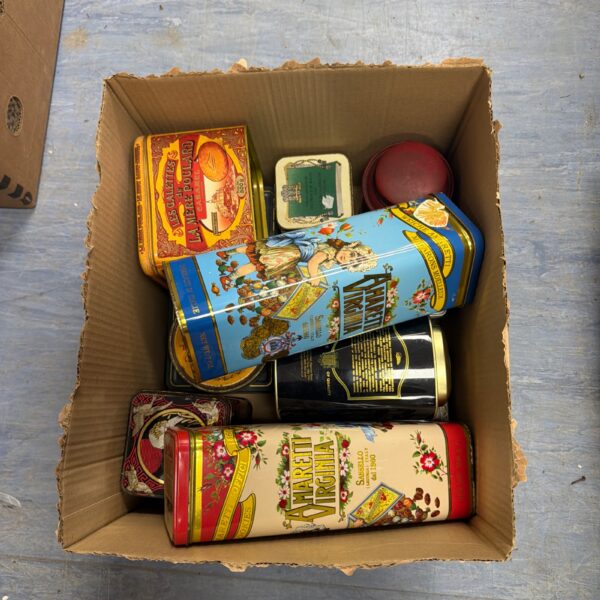 Vintage decorative tin lot with colourful designs and floral patterns.