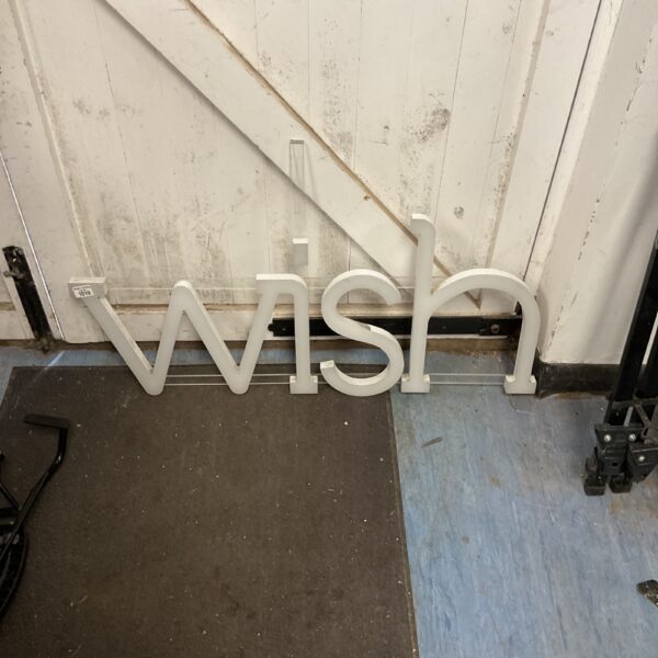 White metal decorative "wish" sign for wall display.