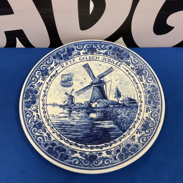 Hand-painted Delft blue Golden Jubilee plate with Dutch landscape.