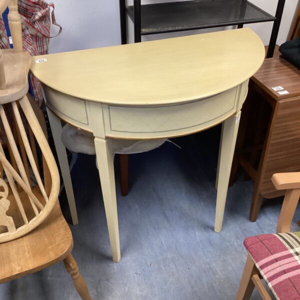 Painted demi lunge hall table with curved front and aged patina.