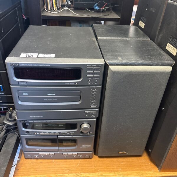 Vintage Denon CD changer system with tuner and speakers.