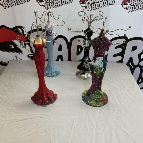 Vibrant designer jewellery hanger with a mannequin form.