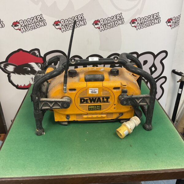 Yellow and black DeWalt DC011 jobsite radio with handle.