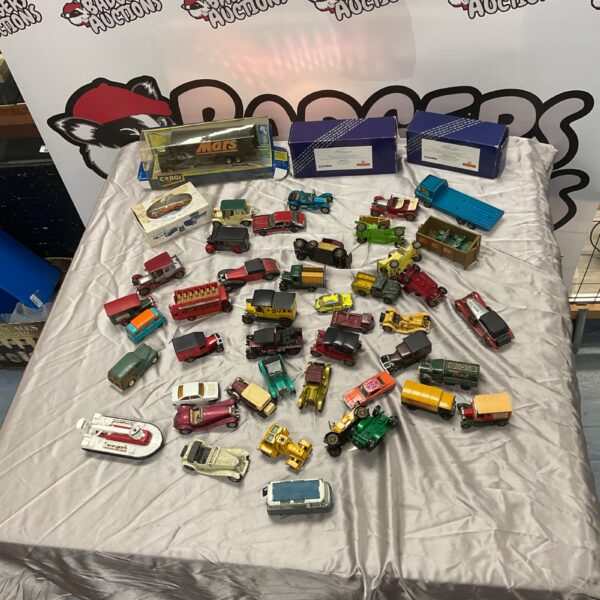 Collection of vintage diecast vehicles including Corgi and Mars models.