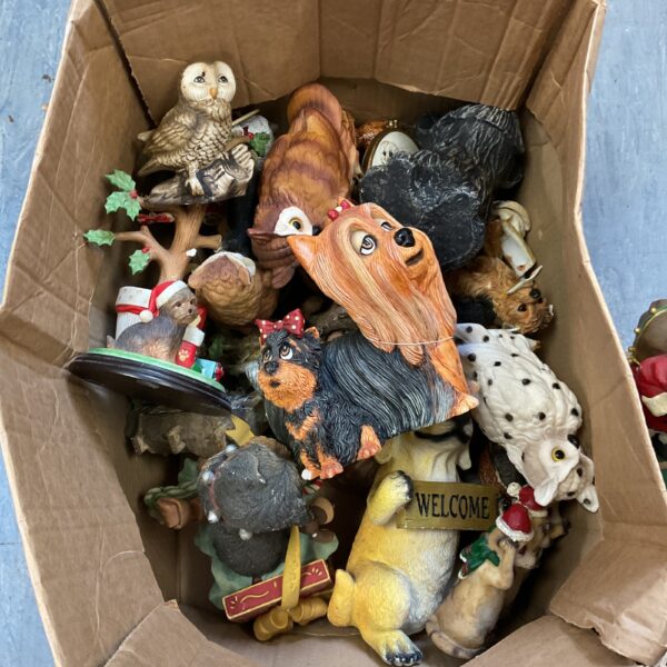Collection of colourful dog ornaments and animal figurines.