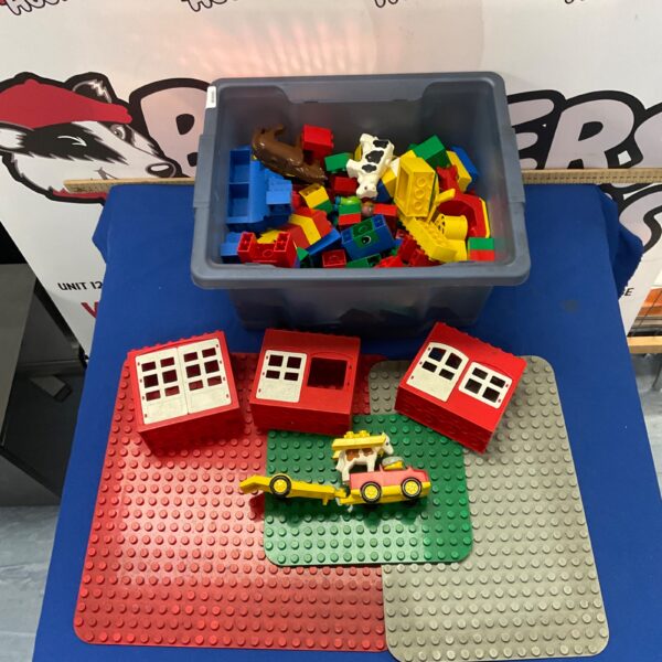 Colourful Duplo building blocks and baseplates for children's play.