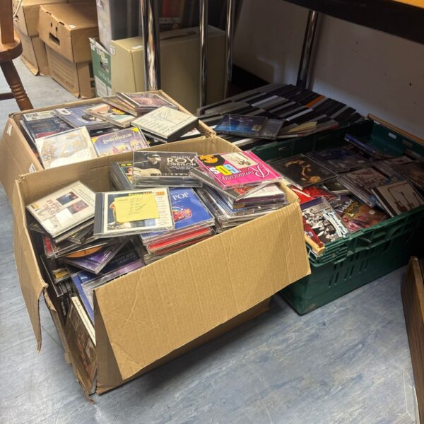 Large job lot of DVDs and CDs for sale.