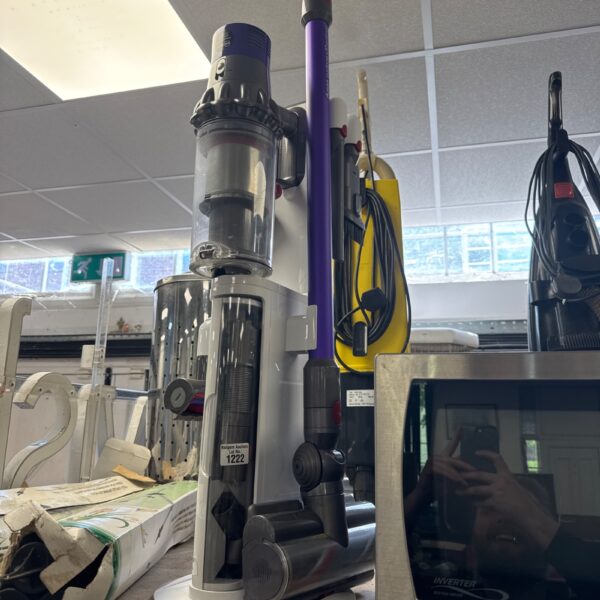 Dyson V10 Animal cordless vacuum cleaner with charging stand.