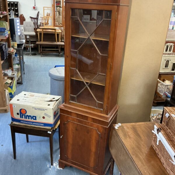 Tall Edwardian mahogany display cabinet with glazed door.