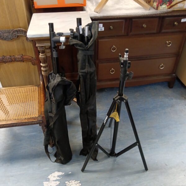 Pair of Emart lighting tripods for studio photography equipment.