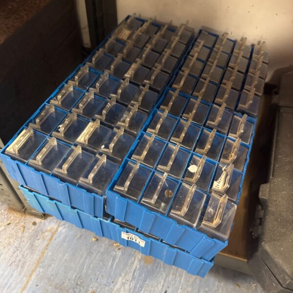 Blue plastic engineers drawer units for workshop storage.