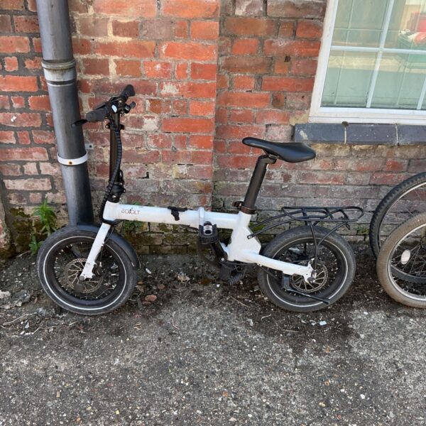 Silver EoVolt folding bike with black tires and components.