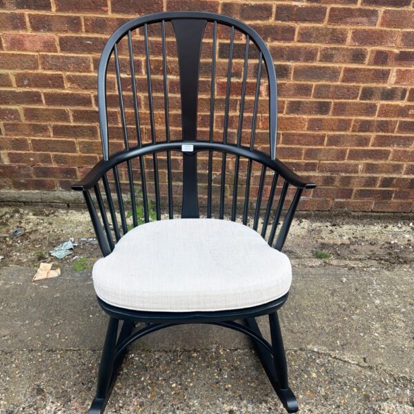 White upholstered seat on Ercol Windsor rocking chair.