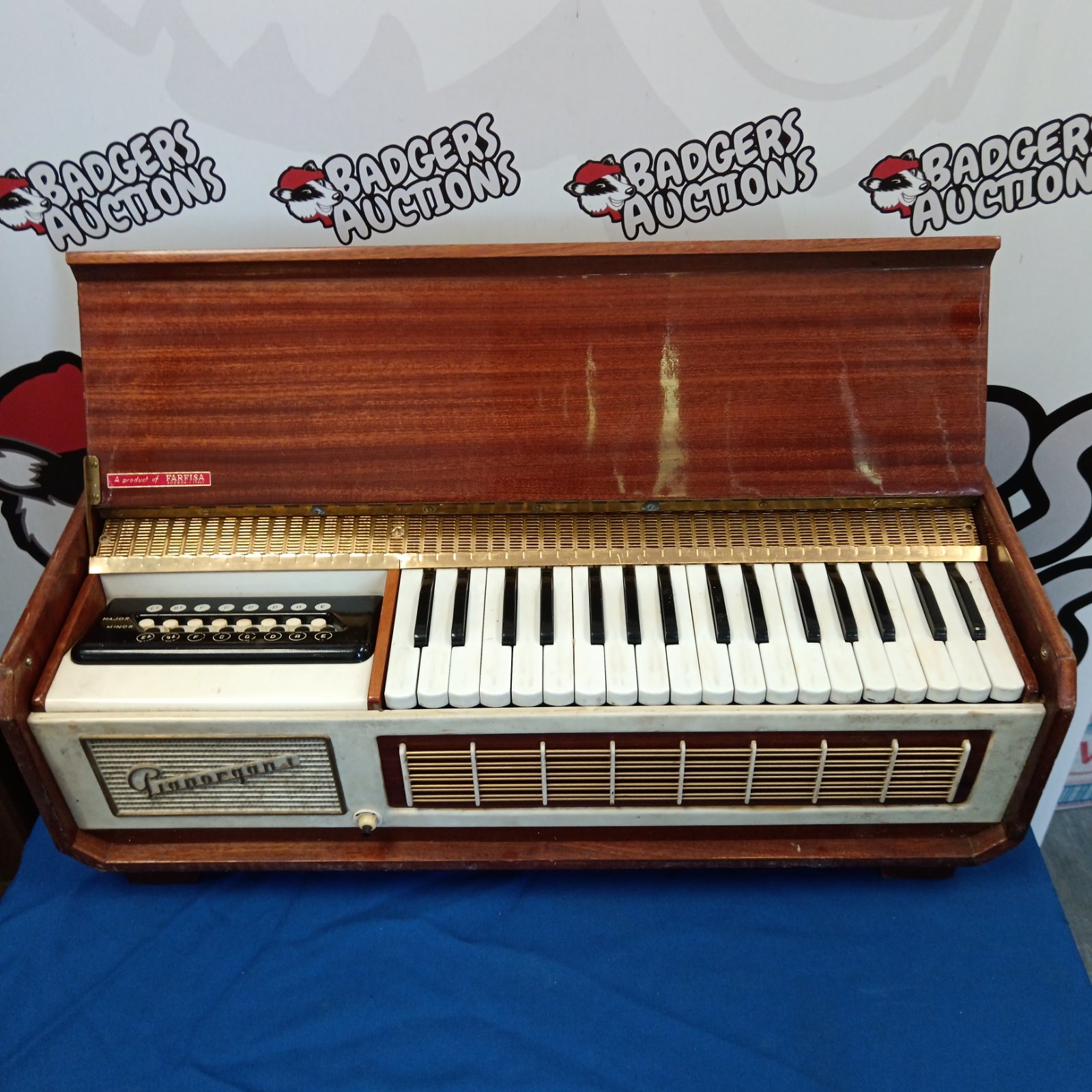 Vintage Farfisa Pianorgan electric organ with wooden cabinet.