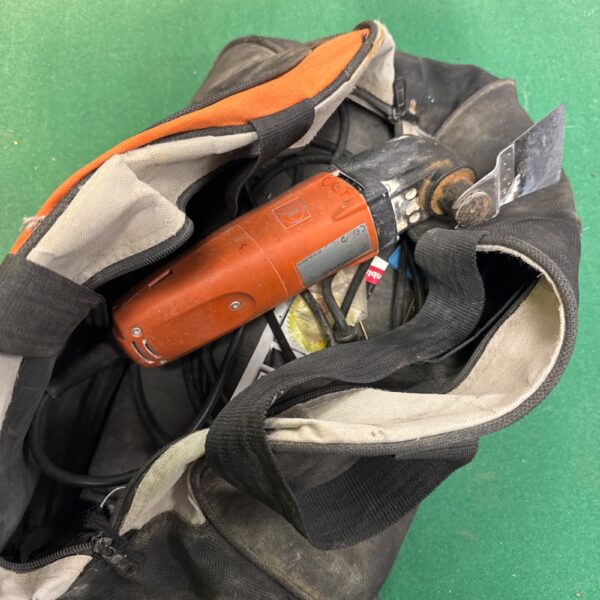 Fein FMM250Q Omni Tool with bag, showing signs of use.