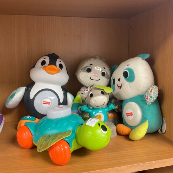 Fisher Price animal toy lot featuring a penguin, turtle, sloth, and panda.