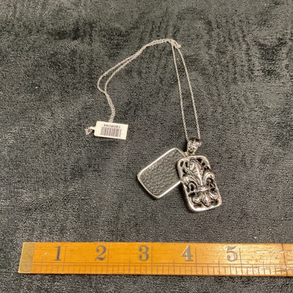Silver tone fleur-de-lis pendant necklace, vintage floral jewelry.