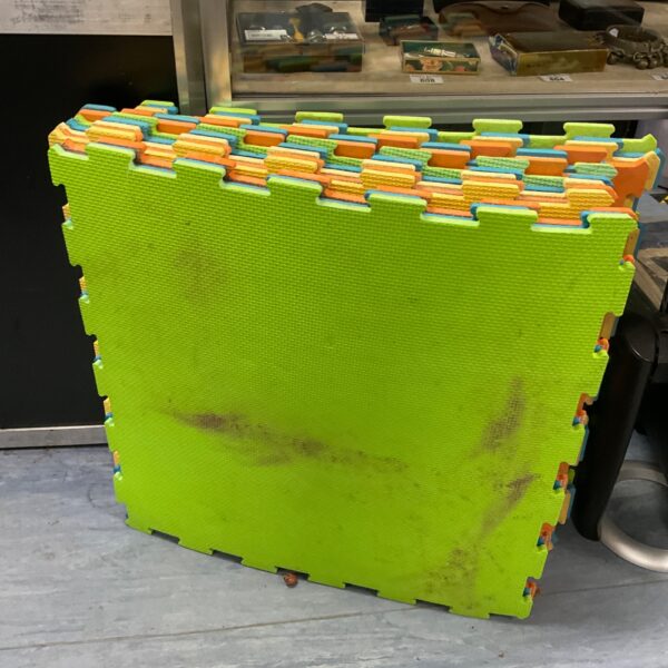 Bundle of colourful foam floor tiles for play or gym use.