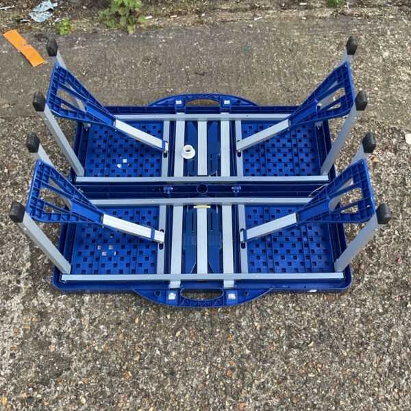 Overhead view of two blue foldable mini tables.