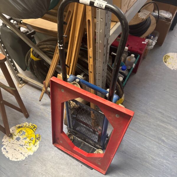 Vintage folding sack barrow with dolly wheels for easy transport.