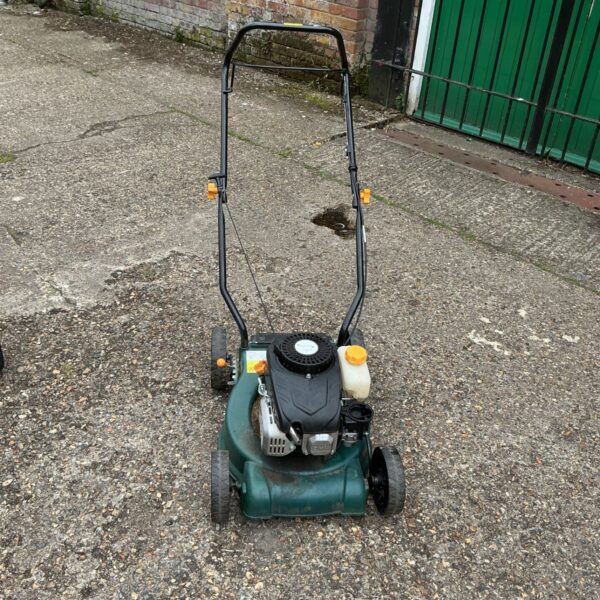 Used FPLM petrol lawnmower in a garden setting.